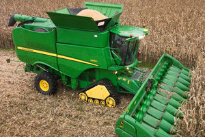 A harvesting surge across much of the country caused corn and soybean futures to drop 