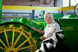 The John Deere Collectors' Center once displayed antique tractor displays like these (above) and hosted auction events, before being part of a consolidation effort in downtown Moline