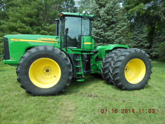 This 2007 JD 9520 4WD bareback tractor with only 519 hours sold for $171,000 on an August 26, 2014 farm auction in north-central Iowa