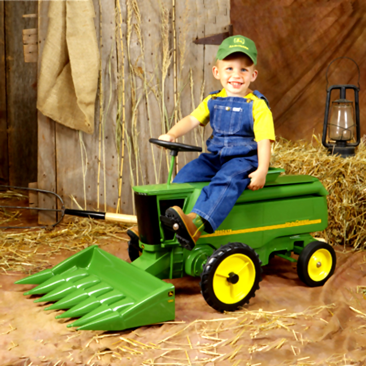 little boy riding john deere tractor