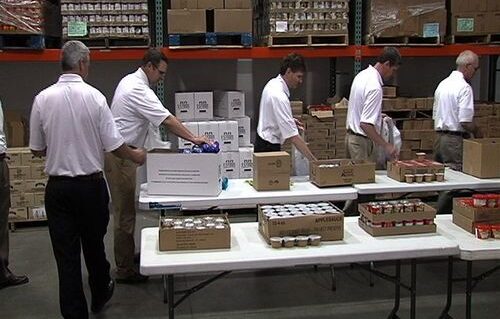 John Deere Employees Packing Backpacks