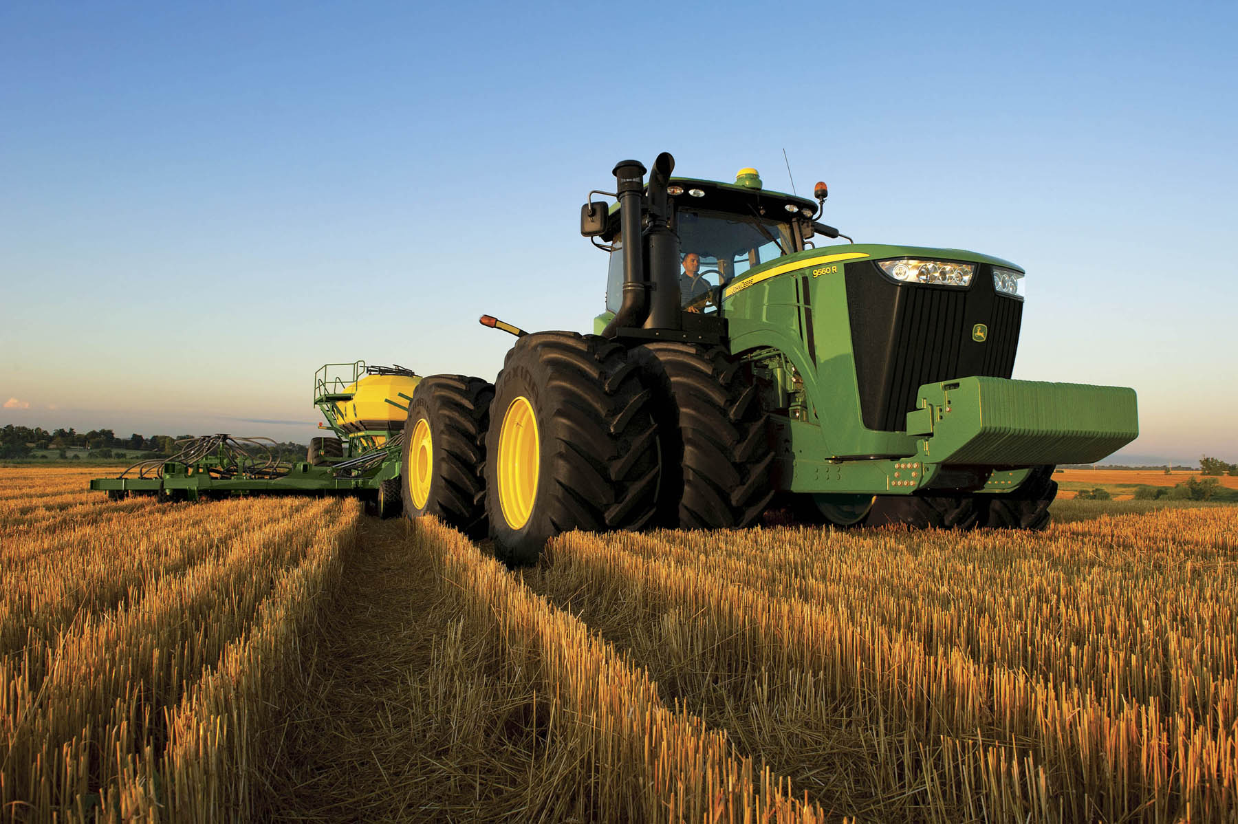 john deere tractors in field