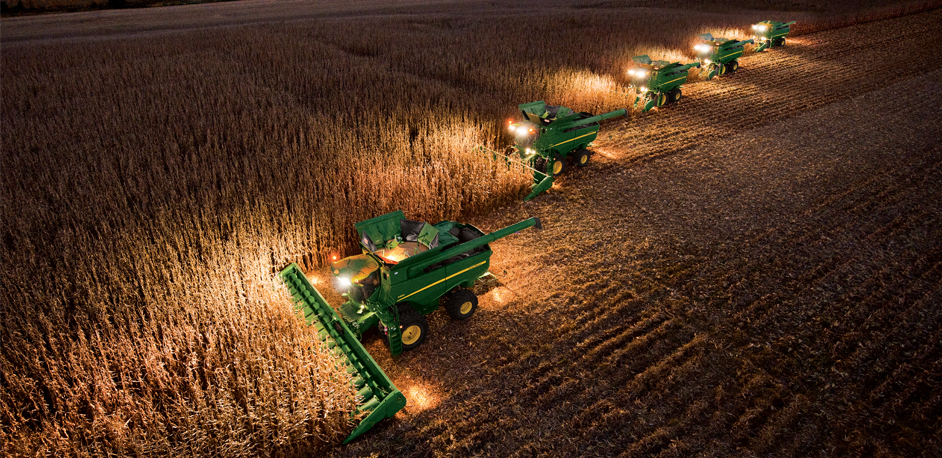 john deere combines in the field