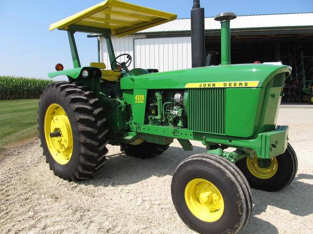 This restored 1972 JD 4320 diesel tractor with 7,000 hours sold for $31,250 on a November 2, 2013 farm auction in Springville, IA