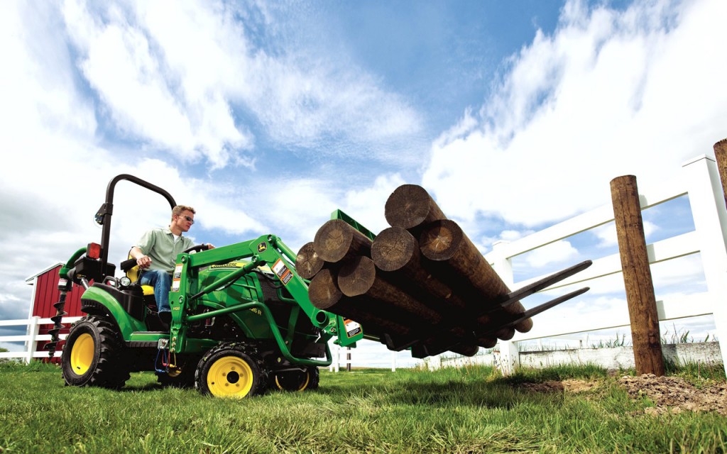 John Deere Utility Tractor with Logs