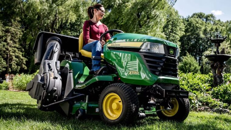 John Deere bagger system mounted on lawn tractor collecting grass clippings