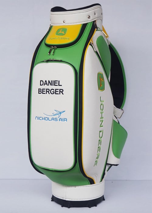 Daniel Berger's golf bag featuring John Deere branding.