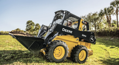 John Deere skid steer in a field