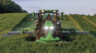 John Deere tractor harvesting crops