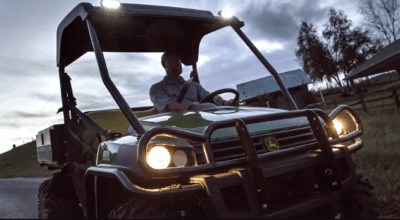 Man driving a John Deere 825i gator