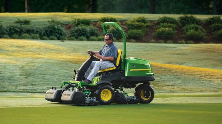 John Deere 2400 PrecisionCut triplex mower cutting a golf course putting green.