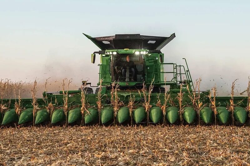 John Deere corn head working in a field.