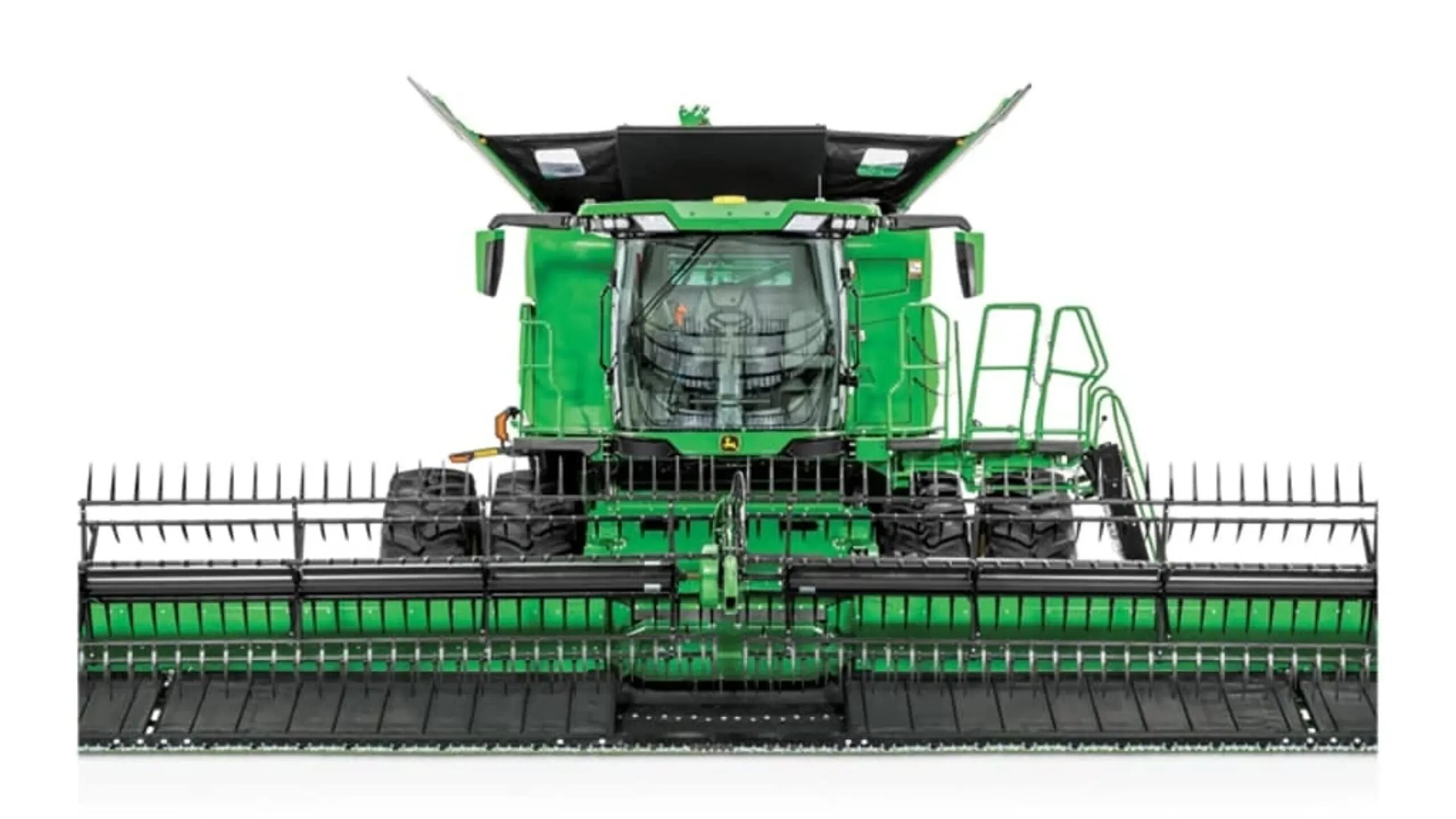 Front view of a John Deere combine equipped with an RDF35 rigid draper header with a flex knife.